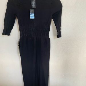 Brand new, never worn black sexy dress with 3/4 sleeves and see through panels